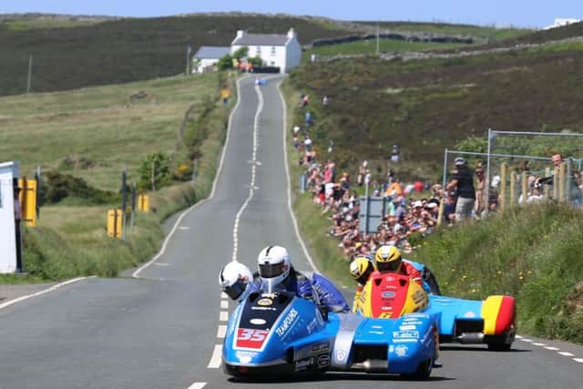 Jeven Walmsley and driver Pete Founds on their way to second place at the Isle of Man TT EMN-160718-164839002