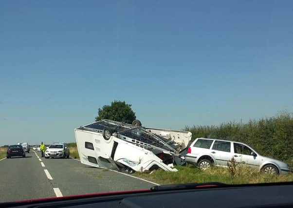 Wreckage. The overturned caravan on the A15. Photo by Neil Parnham. EMN-160720-085758001
