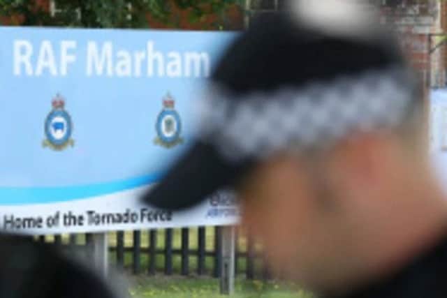 Armed police at RAF Marham today. Photo: PA