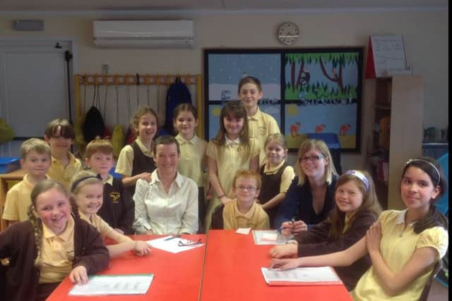 Teacher Jane Pain at The Richmond School in Skegness with members of the school council on her retirement after 26 years. ANL-160728-151408001