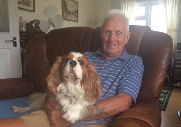 Raymond Hutchinson relaxing with his dog Oscar. ANL-160729-123631001