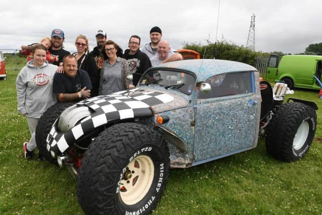 Bullfrog Bash at Sleaford Rugby Club. L-R Vicky Watt, Stu Boulton with Caleb Boulton 1, Drew Levens, Kate Boulton, Sam Maycock, Claire Ibbetson, Dan Ibbetson, Tank Laxton and Steve Parker with his modified VW Beetle called Fugly. EMN-160722-113946001