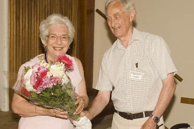Philip Groves presented Daphne Bloom with a bouquet of flowers in appreciation of her 12 years of service. EMN-160729-192136001