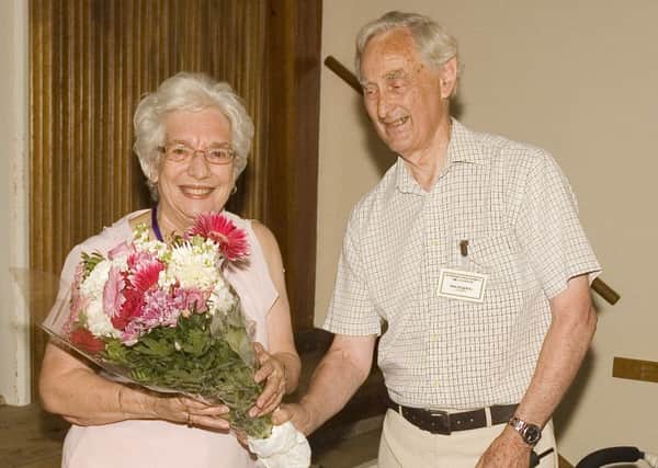 Philip Groves presented Daphne Bloom with a bouquet of flowers in appreciation of her 12 years of service. EMN-160729-192136001