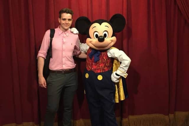 Joshua Scarfe arrives in Disney World in Florida, welcomed by Mickey Mouse. EMN-160719-083237001