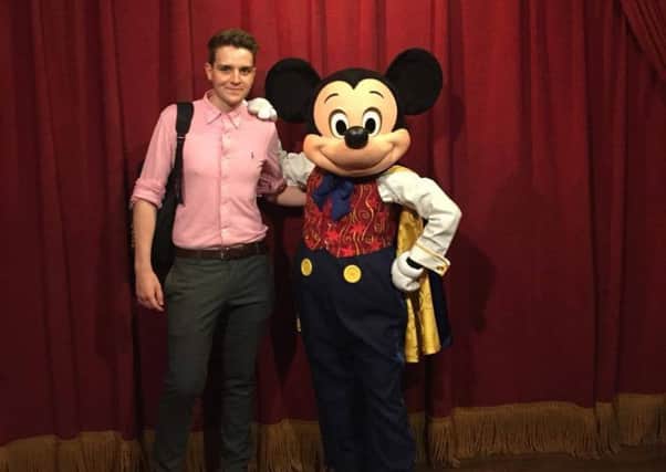 Joshua Scarfe arrives in Disney World in Florida, welcomed by Mickey Mouse. EMN-160719-083237001