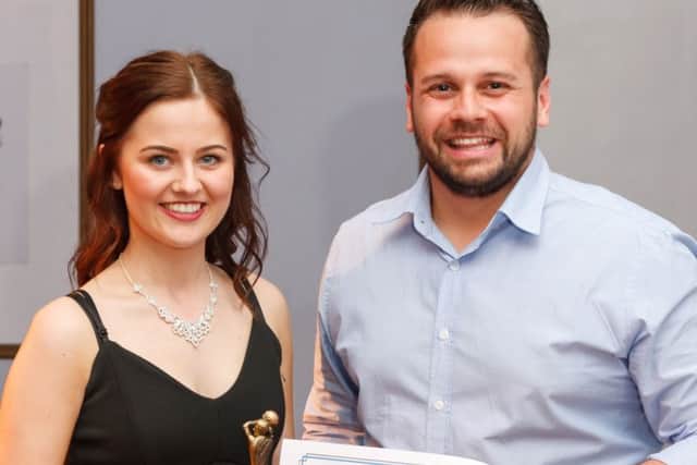 Young Player of the Season Natasha Scott receives the Pat Fountain Memorial Award from Pats grandson Nyle Chapman EMN-160725-161021002