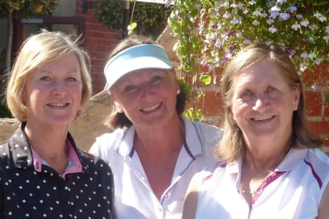 Ping qualifiers Sandra Crow (left) and Bridget Hardaway (right) with lady captain Penny Buckley EMN-160725-164929002
