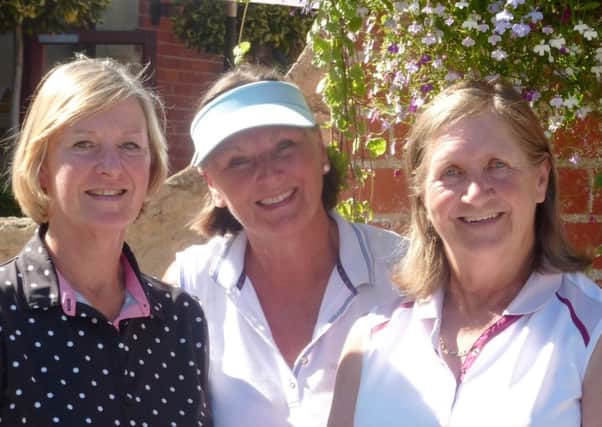 Ping qualifiers Sandra Crow (left) and Bridget Hardaway (right) with lady captain Penny Buckley EMN-160725-164929002