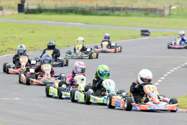 Liam Hartley (Cadwell) leads with Grimsbys Chloe Buckley in third EMN-160725-180208002