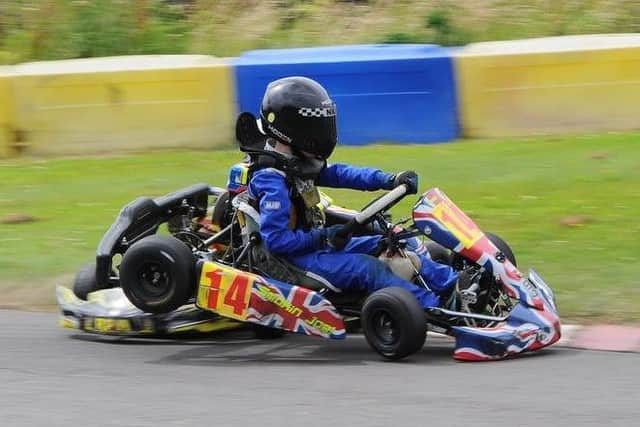 Joe Harrison gets in a first corner tangle in the Bambino class EMN-160725-183618002