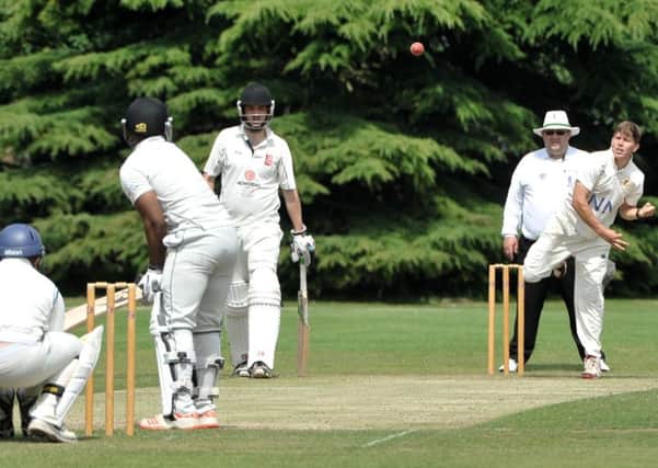 Ross Dixon bowling for Woodhall Spa at Nettleham, where he bagged three wickets. Photo: Nigel West