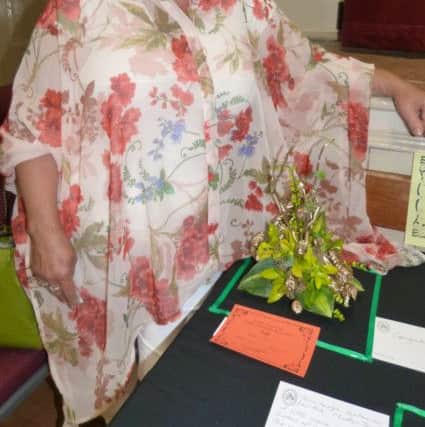 Caroline Jackson with her winning Midas Touch display for class 8.  (Lin) EMN-160726-152403001