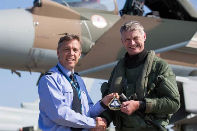 Air Commodore Duguid (left) presents Flt Lt Watts with his patch EMN-160729-090342001