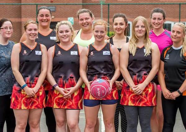 All smiles: Members of the Hotshots netball squad who are hoping to attract new sponsors. Photo: John Aron
