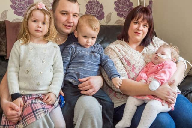 L-r Evie age 3, Gary, Harry age 2 Stacey with Olivia EMN-160508-142917001