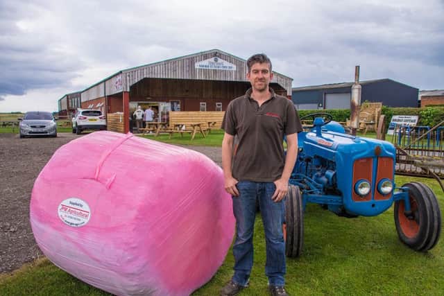 Phil from JPM Agricultural with one of the pink hay bales.