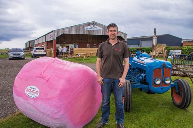 Phil from JPM Agricultural with one of the pink hay bales.
