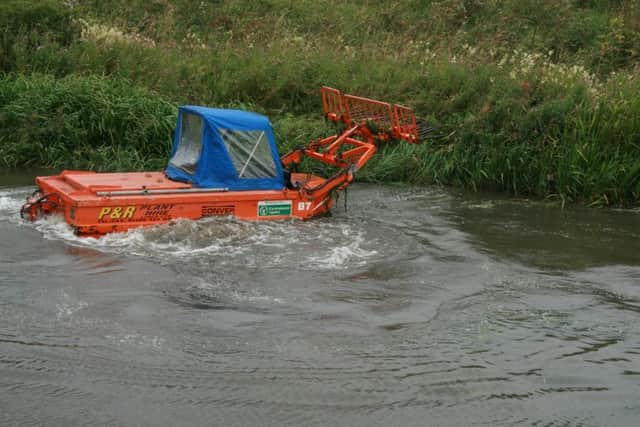 Weed cutting machines at work on a stretch of the Ancholme off Cadney Road in Brigg in the past week. EMN-160108-121613001