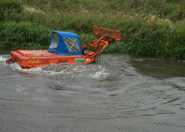 Weed cutting machines at work on a stretch of the Ancholme off Cadney Road in Brigg in the past week. EMN-160108-121613001
