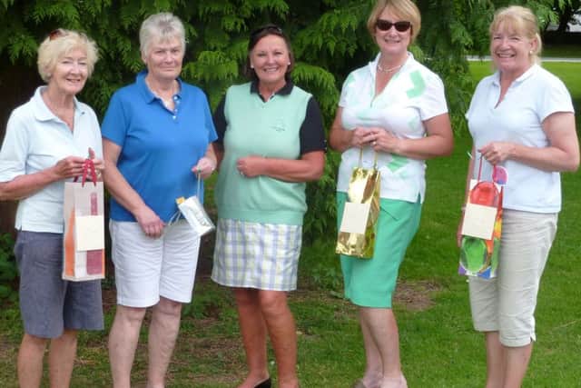 Ladies Charity Day winner Wendy Beaumont (right) with, from left, runner-up Jan Heath, fourth-placed Jenny Rickett, lady captain Penny Buckley, and third-placed Jane Briggs EMN-160108-145352002