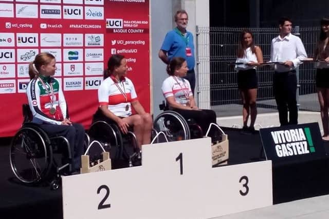 Liz (right) about to receive one of her two World Cup medals in Bilbao EMN-160108-164119002