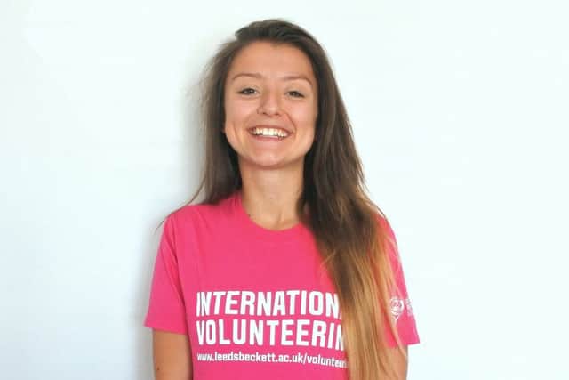 Kirby Mansfield wearing her International Volunteering t-shirt