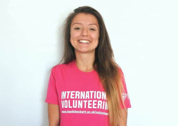 Kirby Mansfield wearing her International Volunteering t-shirt