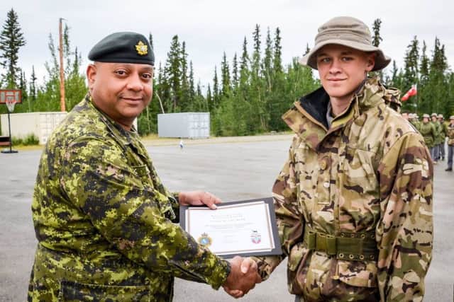 Cadet Lance Corporal Lewis Needham receives cadet of the week certificate. EMN-160408-150245001