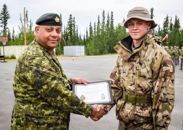 Cadet Lance Corporal Lewis Needham receives cadet of the week certificate. EMN-160408-150245001