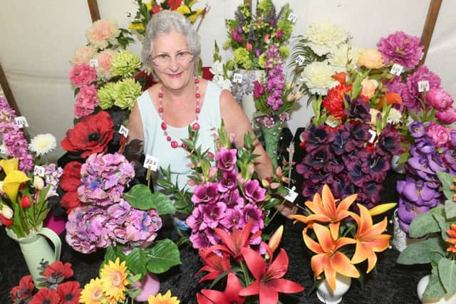 Revesby Country Fair. Mollie Aucott of Holbeach with silk flower arrangements. EMN-160808-111532001