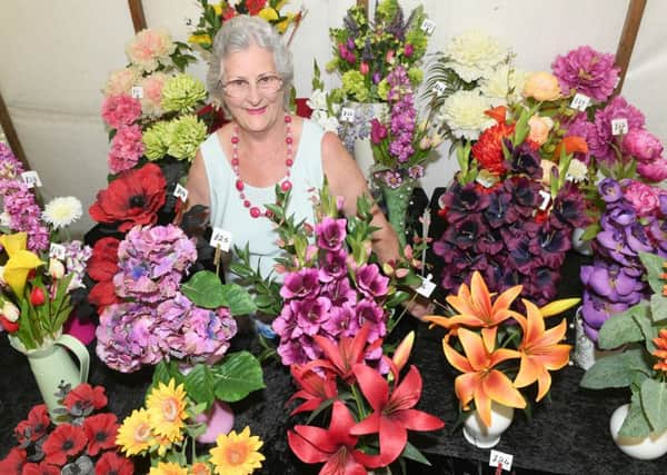 Revesby Country Fair. Mollie Aucott of Holbeach with silk flower arrangements. EMN-160808-111532001