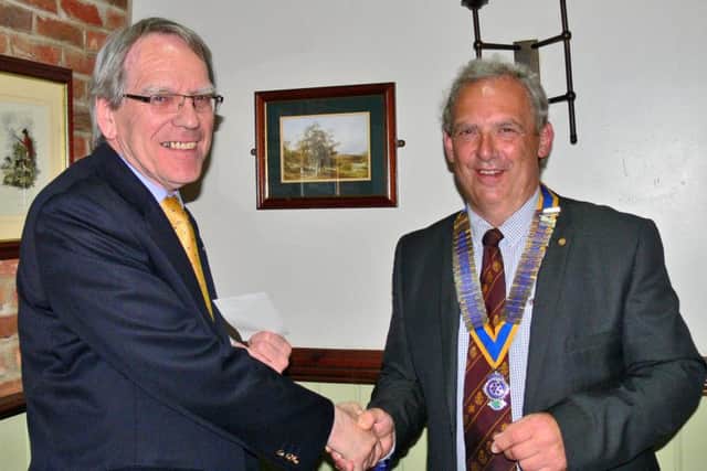 Retiring Brigg Rotary President Nick Wells (right) hands over a cheque for ?500 to Richard Alderson from Nettleton of Lincolnshire Rural Stress Network, some of the total sum of ?4,000 awarded to local charities. EMN-161008-220500001