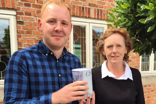 Luke Porter and Coun Jan Brealeycook with the collection tin.