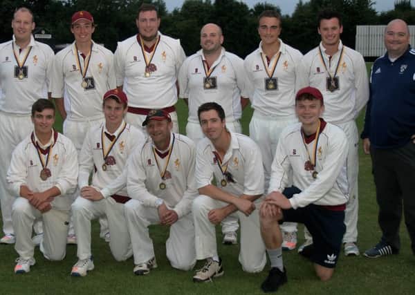 Louth CC proudly display their Grimsby Town Knockout medals EMN-160508-095200002