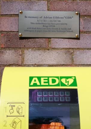 A defibrillator and plaque have been placed on the wall of Brigg Youth Centre in memory of teacher Adrian Gibbons. EMN-160818-120700001
