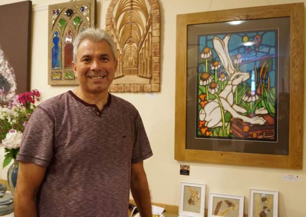 Richard Chuck is one of the returning artists to this years event with his stained glass style artworks. EMN-160821-164813001