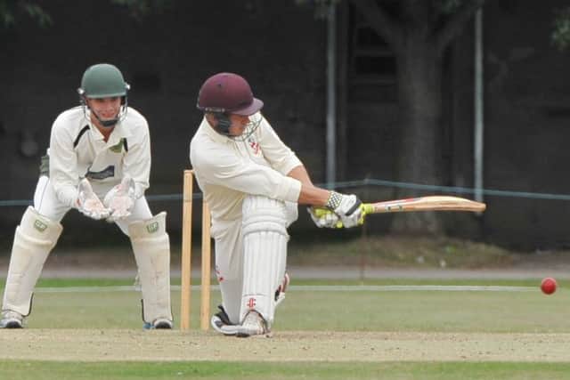 Skegness skipper Sean Chamberlain sweeps Paul Deans towards the boundary.