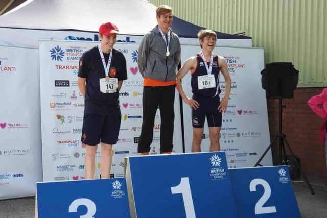 Declan celebrates on the podium.