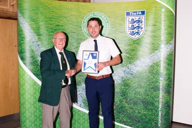 Alistair Wilson collects his award.