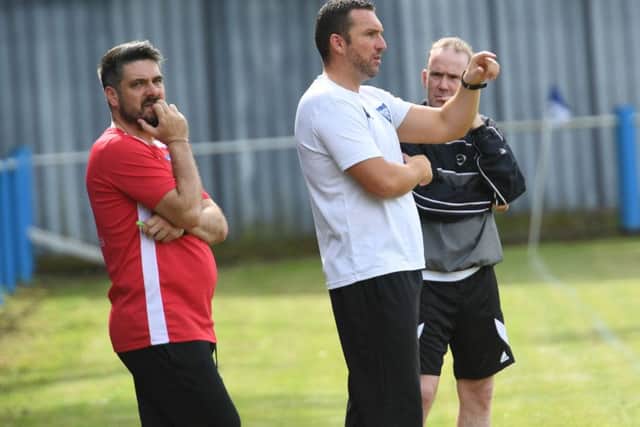 Nathan Collins and assistant Daryl Clare.
