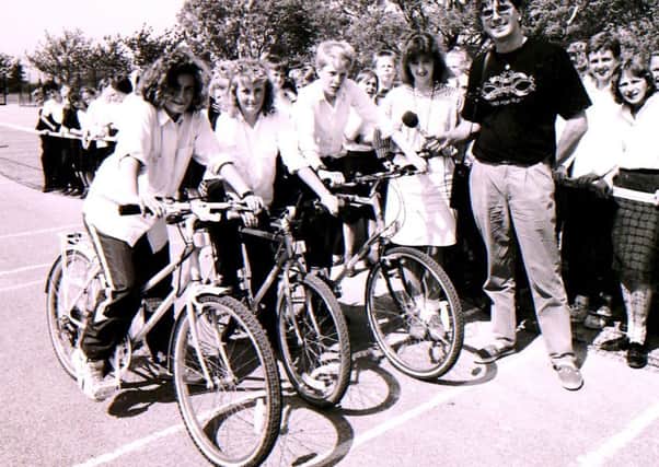 BBC Radio Lincolnshire presenter Dave Bussey and students raising money at Sir William Robertson School in Welbourn back in 1991. EMN-160817-104531001