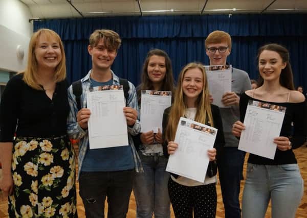 The five A* English students - James Mayer, Laurie Shackleton, Hariett Bibby, Gabriel Clarkson and Ciara Dodd -  with Sarah Peacock, Head of English at De Aston EMN-160818-095538001