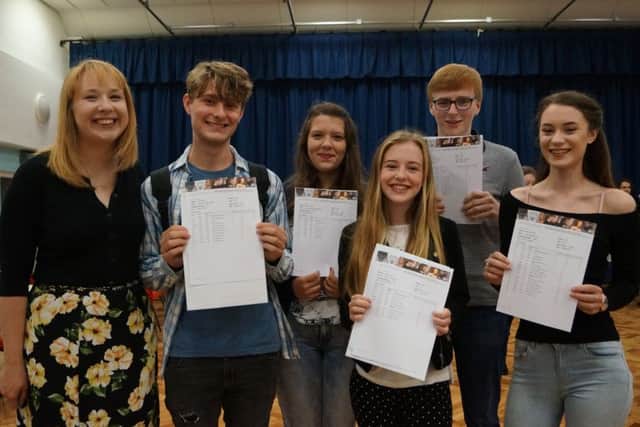 The five A* English students - James Mayer, Laurie Shackleton, Hariett Bibby, Gabriel Clarkson and Ciara Dodd - with Sarah Peacock, Head of English at De Aston EMN-160818-095538001