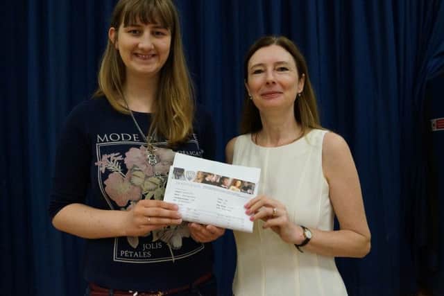 Jade Dowse celebrates her A*, A and B grades with headteacher Ellenor Beighton EMN-160818-104911001