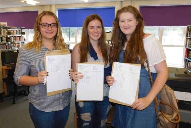Excited with their A level results, Kesteven and Sleaford High School students. From left - Katie Key (A*, A, A) is taking a year out to gain experience at Lincoln courts and prison before applying for university. Bethany Kirwan (A*, A*, A*) is going to do veterinary medicine at Cambridge University. Phoebe Jenkins (A, A, B) will be studying biochemistry at Dundee University. EMN-160818-120045001
