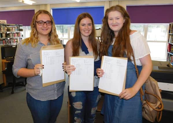 Excited with their A level results, Kesteven and Sleaford High School students. From left - Katie Key (A*, A, A) is taking a year out to gain experience at Lincoln courts and prison before applying for university. Bethany Kirwan (A*, A*, A*) is going to do veterinary medicine at Cambridge University. Phoebe Jenkins (A, A, B) will be studying biochemistry at Dundee University. EMN-160818-120045001
