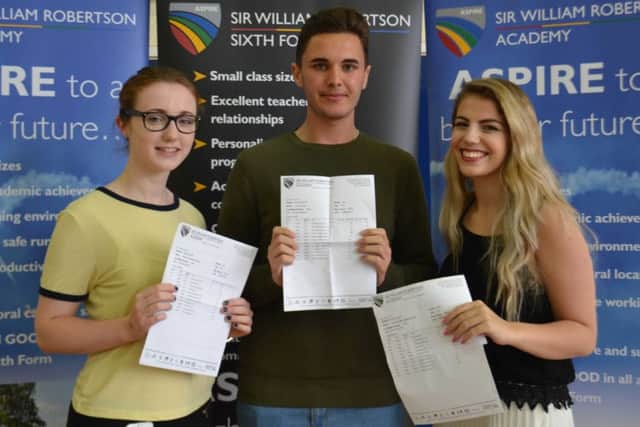 Rachael Sutton, Conor Elliott and Geri Goldstein from Sleaford with their results at Sir William Robertson Academy. EMN-160818-145007001