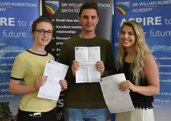 Rachael Sutton, Conor Elliott and Geri Goldstein from Sleaford with their results at Sir William Robertson Academy. EMN-160818-145007001