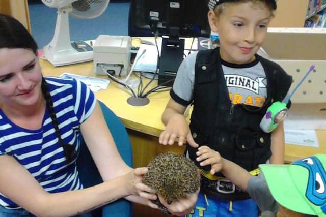 Hedgehog carer Stacy Batham with Callum and Liam Chamber